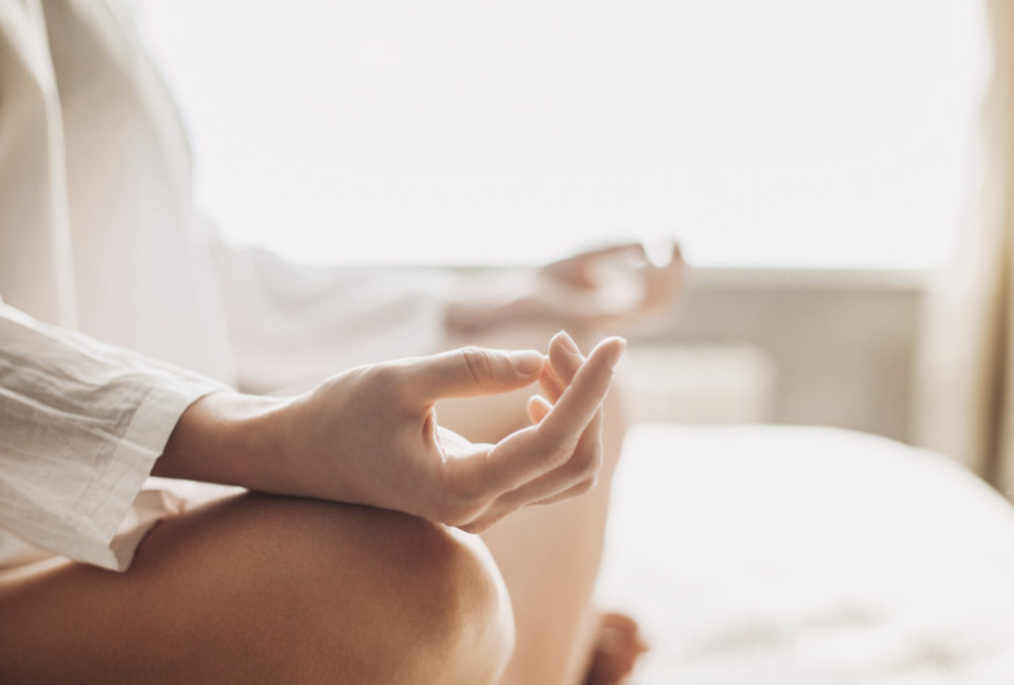 A person sitting cross legged undergoing EMDR therapy