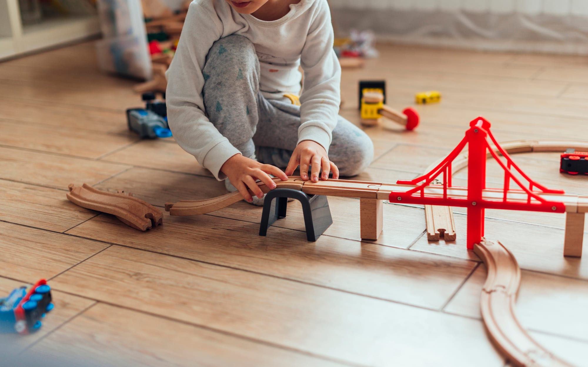 child playing with toys in therapy